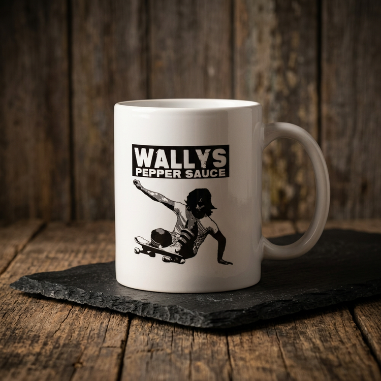 Wallys Pepper Sauce 11oz mug, right side, on black slate on a wood table