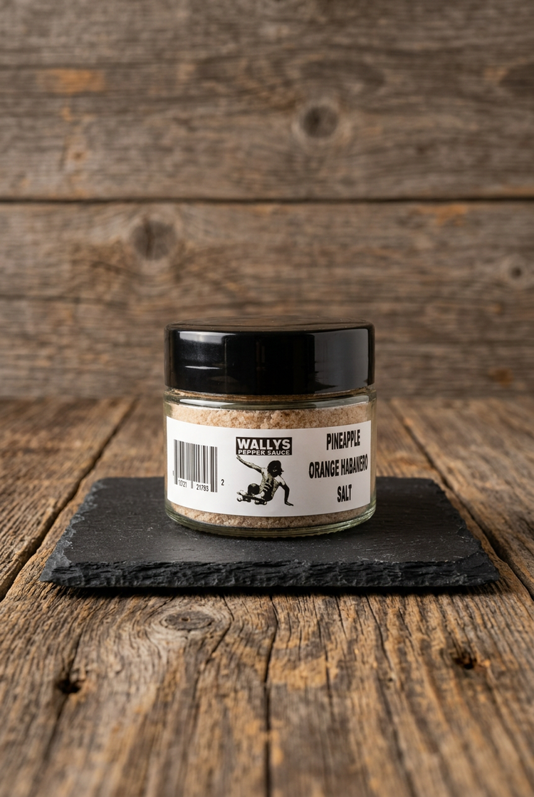 Pineapple Orange Habanero Salt on black slate on a wood table