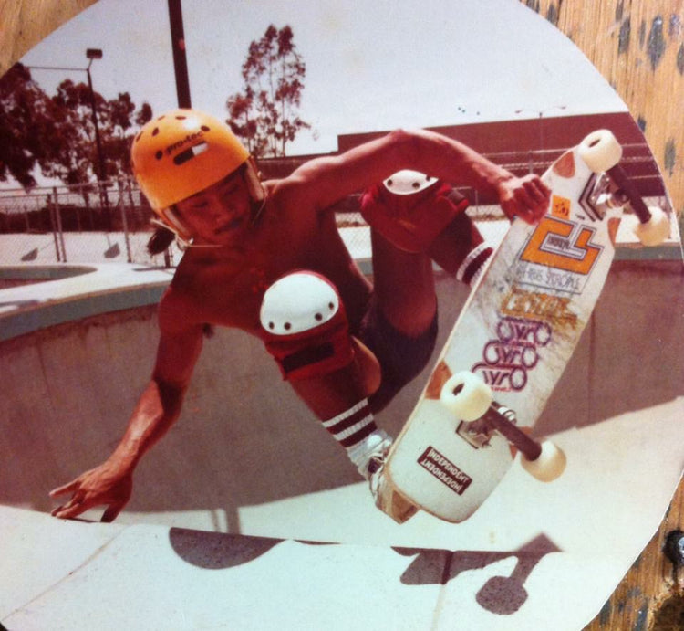 Vintage photo of Wally carving a pool with his IPS board